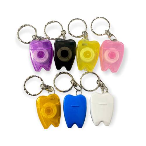 Llavero de muelita con hilo dental